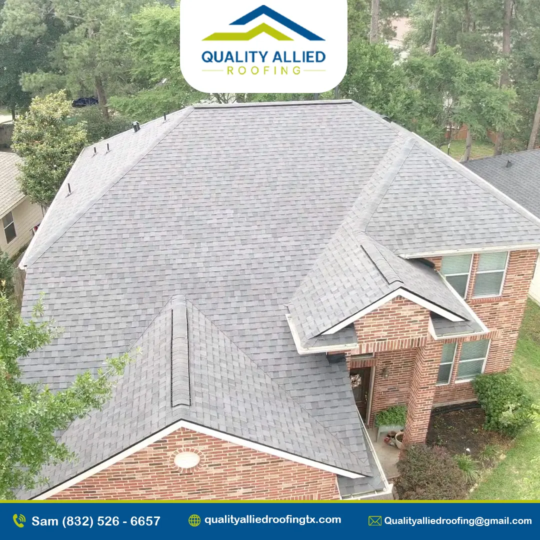 brick house with a gray shingle roof. one of spring roofing services, Quality Allied Roofing's project