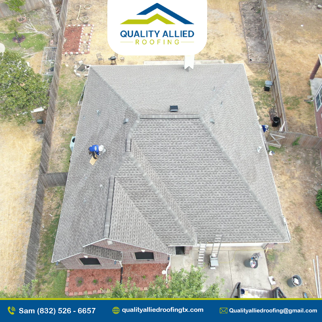 house under construction with a shingled roof and a metal roof extension. A worker from Quality Allied Roofing is installing the roof one of the woodlands roofing projects