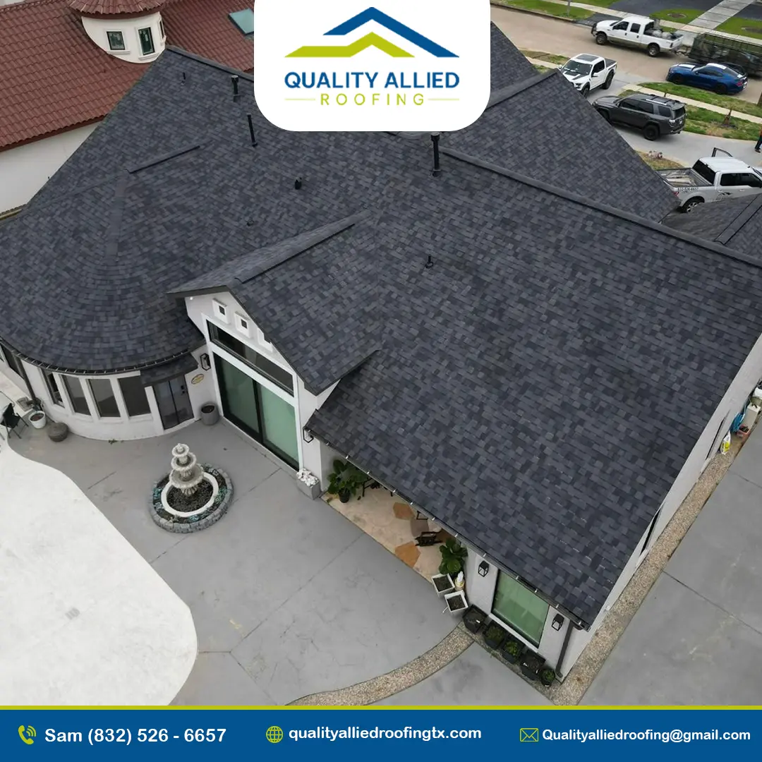 white house with a black shingle roof and water fountain in the front yard. one of Quality Allied Roofing at Sugar Land Roofing