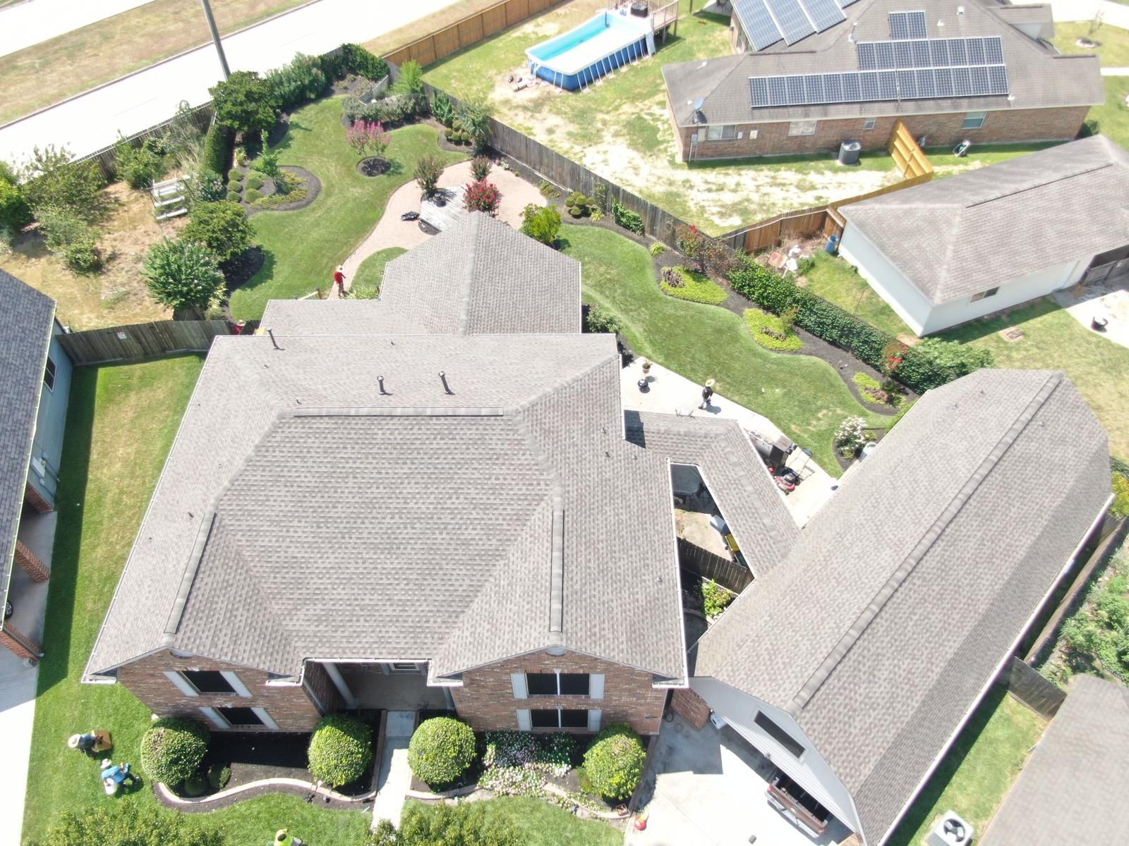 Aerial view of a completed residential shingle roof, photograph 2