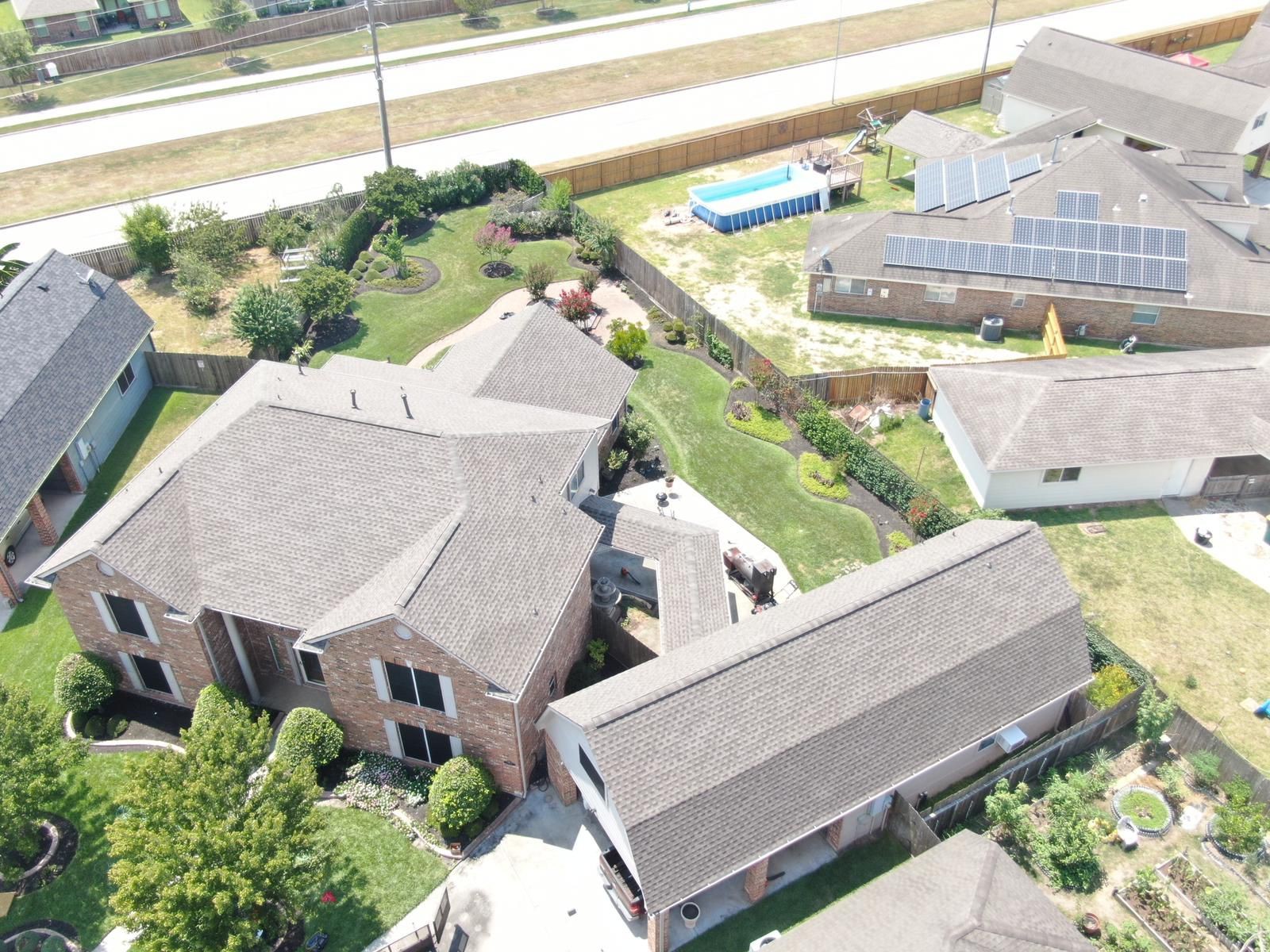 Aerial view of a completed residential shingle roof, photograph 3