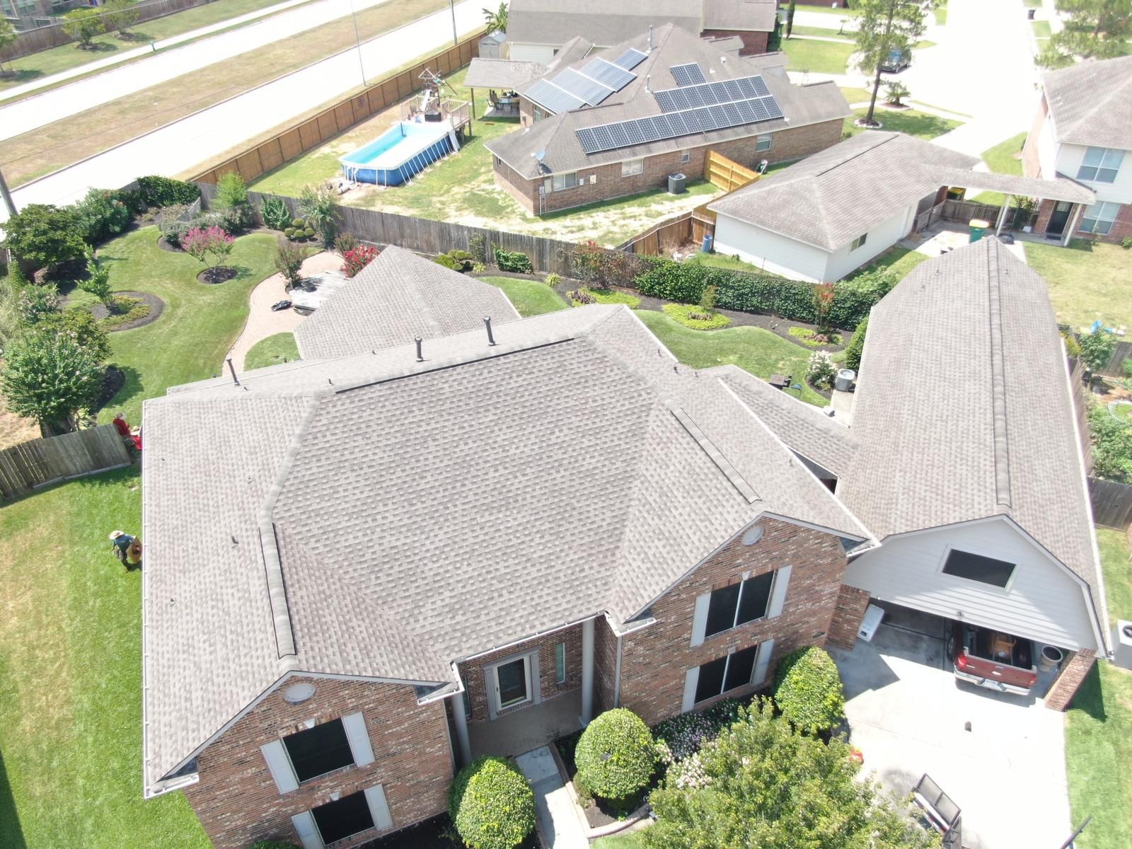 Aerial view of a completed residential shingle roof, photograph 4