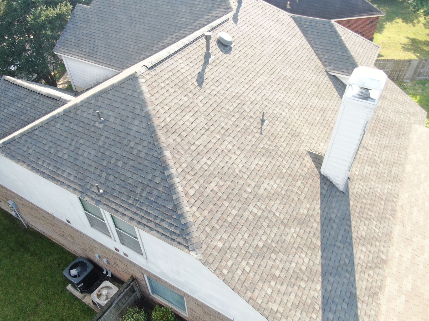 Aerial view of a completed residential shingle roof, photograph 5