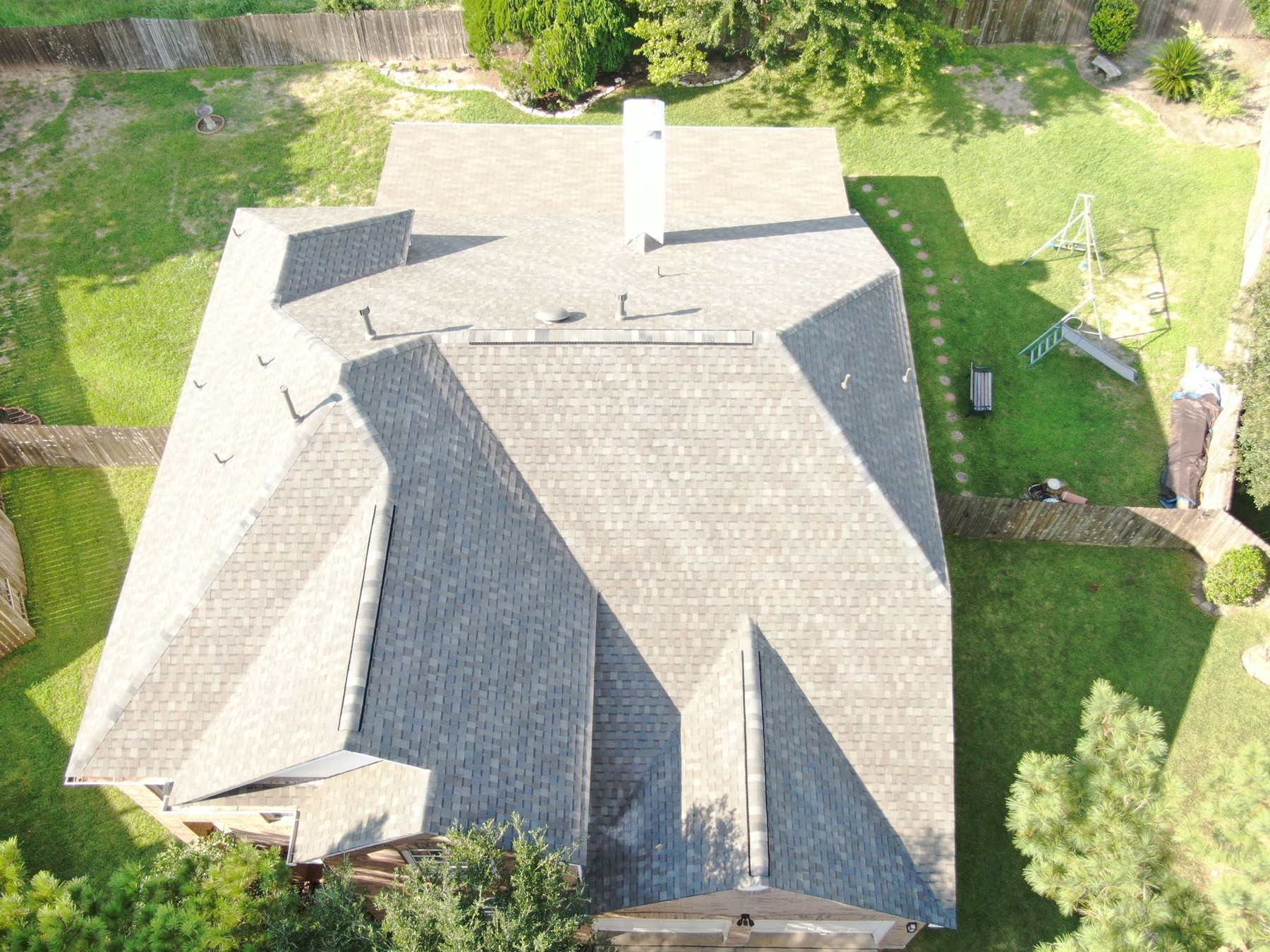Aerial view of a completed residential shingle roof, photograph 6