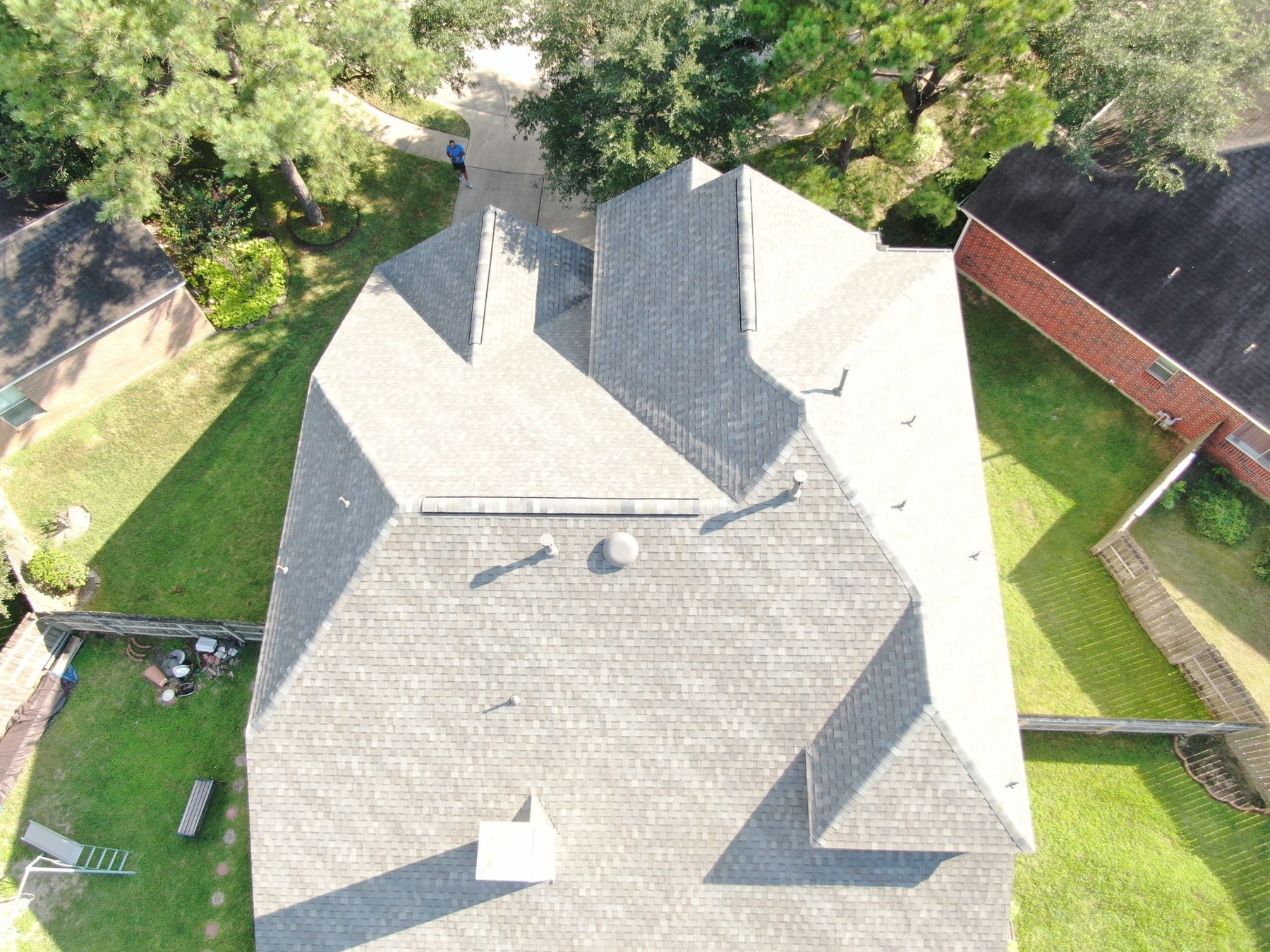 Aerial view of a completed residential shingle roof, photograph 7