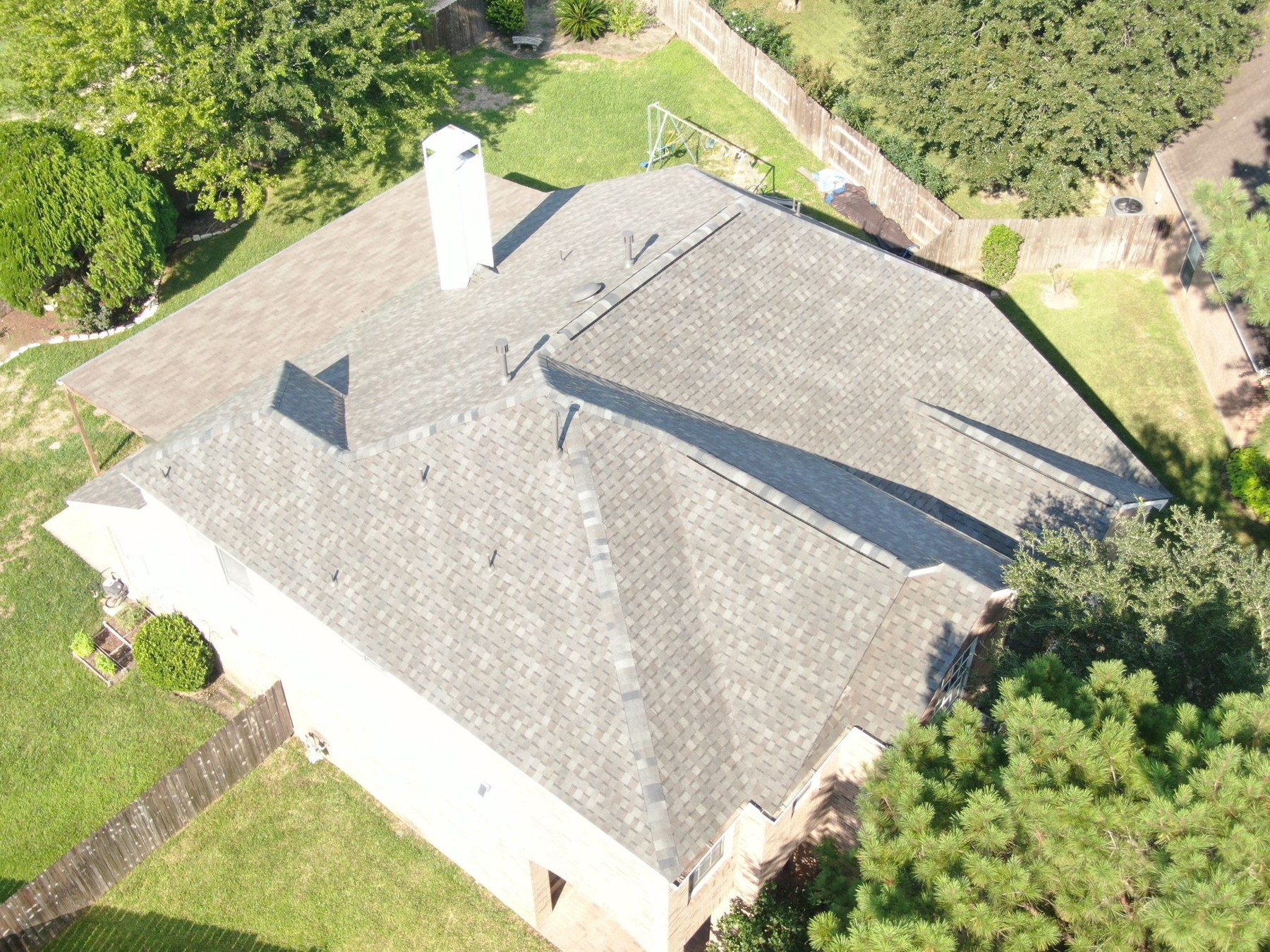 Aerial view of a completed residential shingle roof, photograph 8