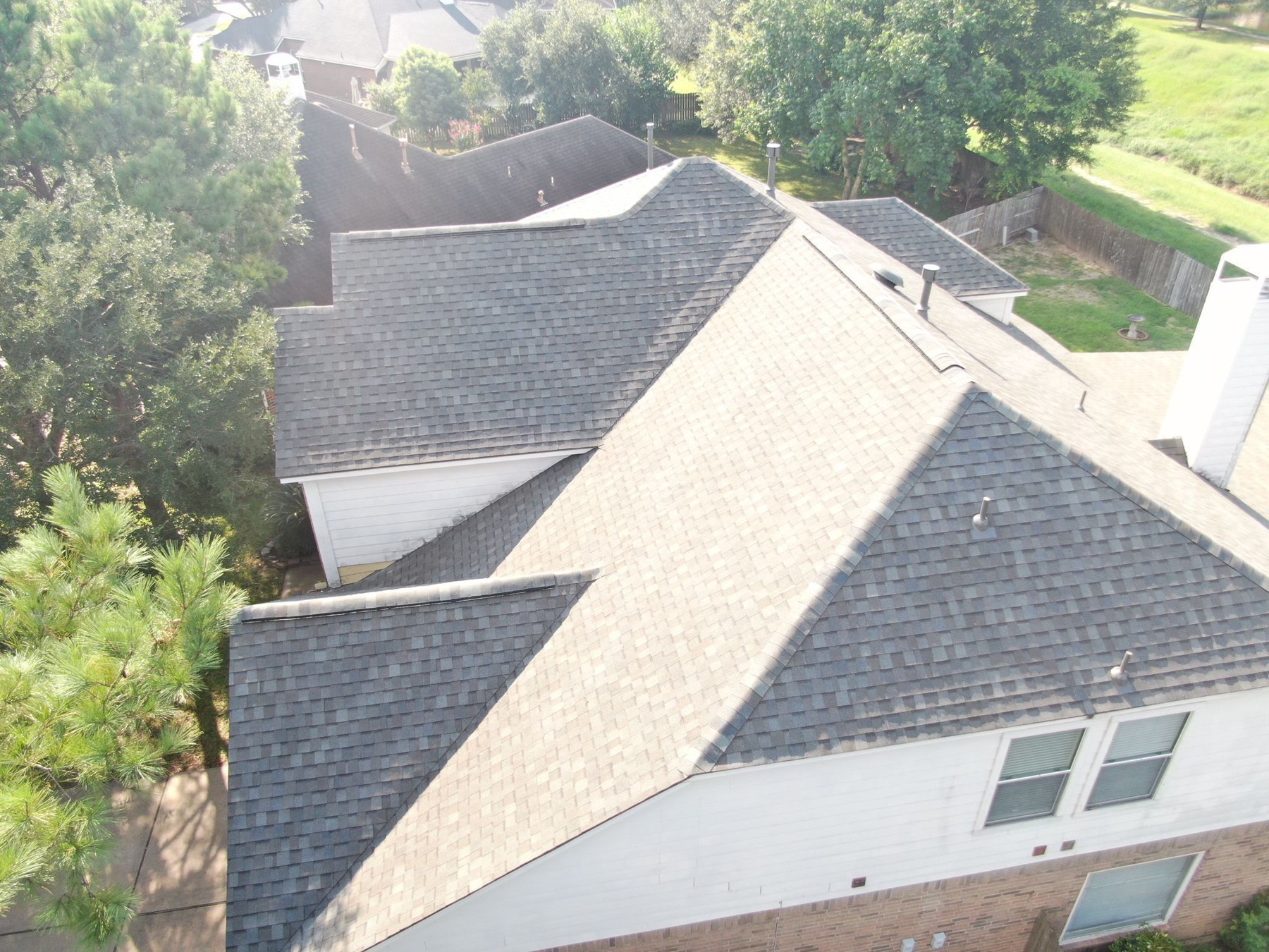 Aerial view of a completed residential shingle roof, photograph 9