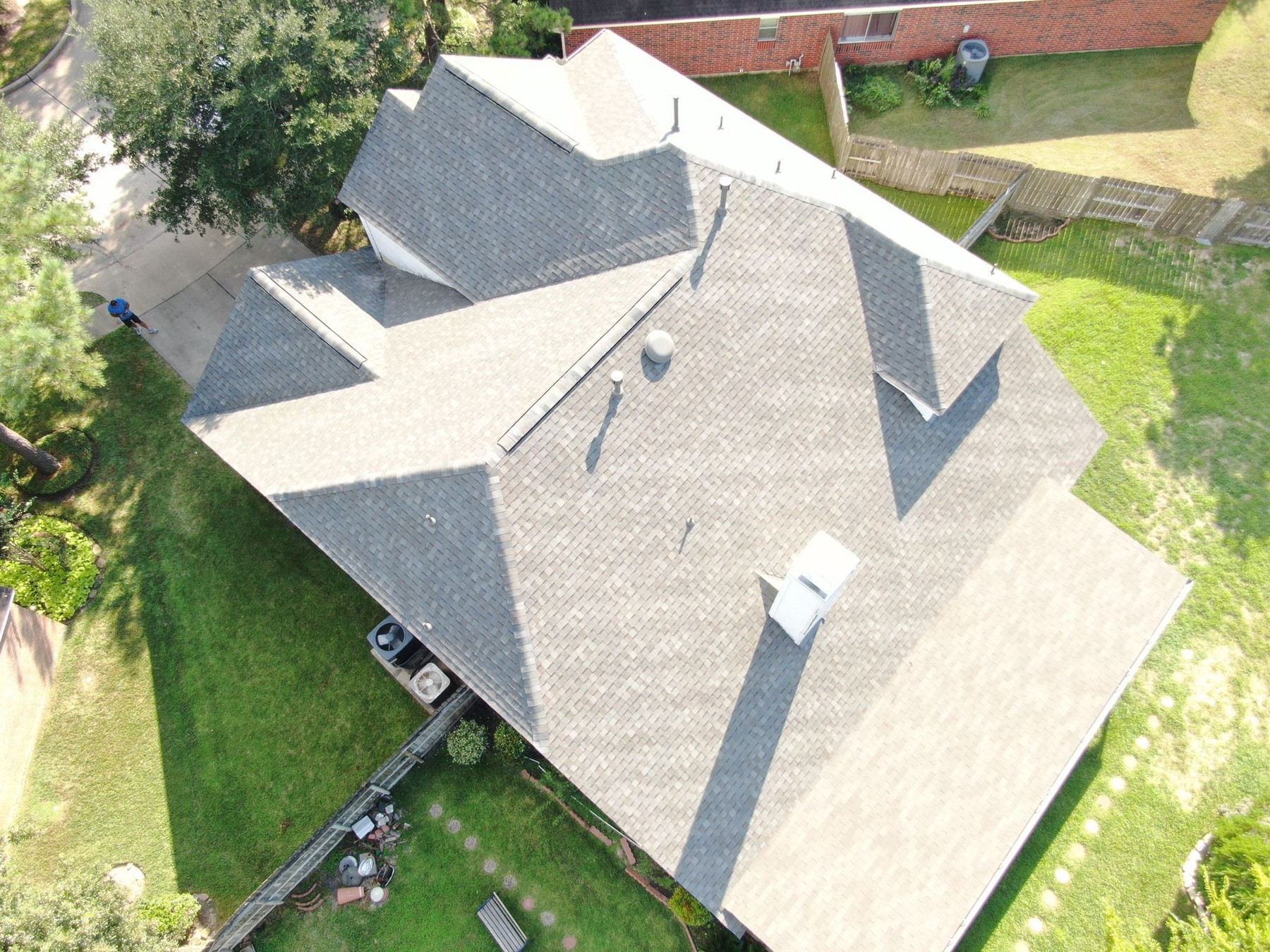Aerial view of a completed residential shingle roof, photograph 10