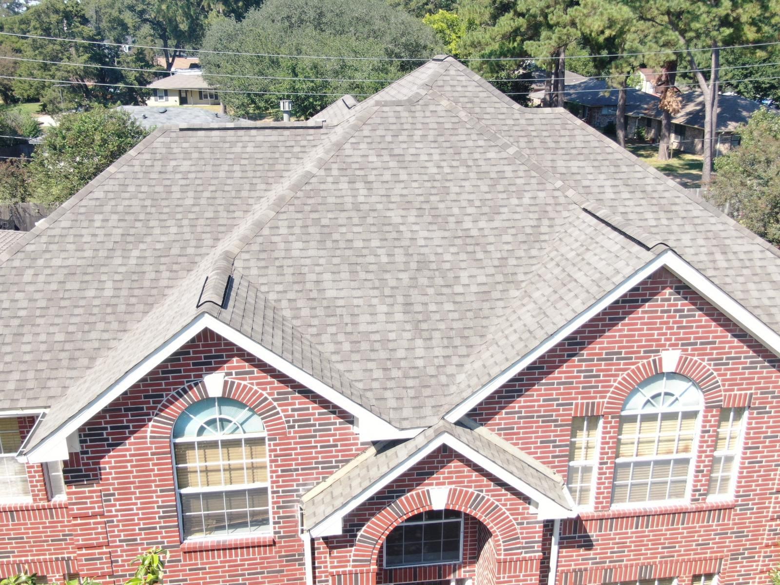 Aerial view of a completed residential shingle roof, photograph 11