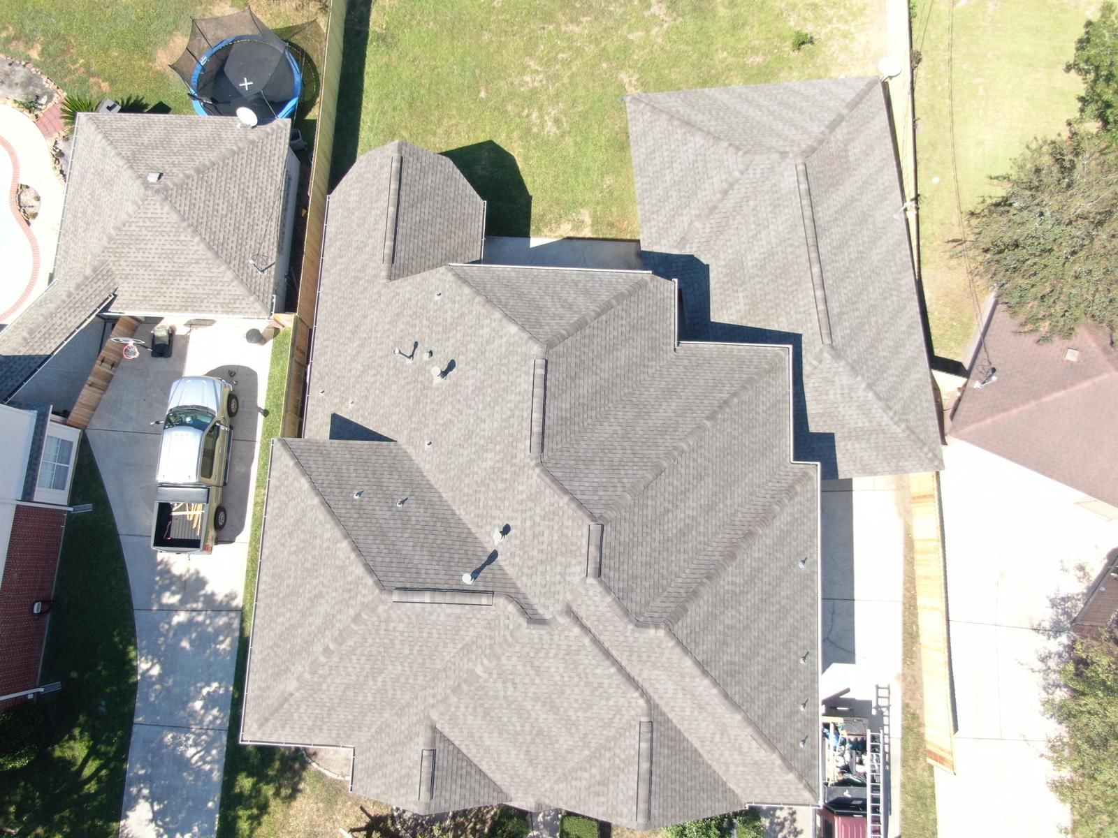 Aerial view of a completed residential shingle roof, photograph 12