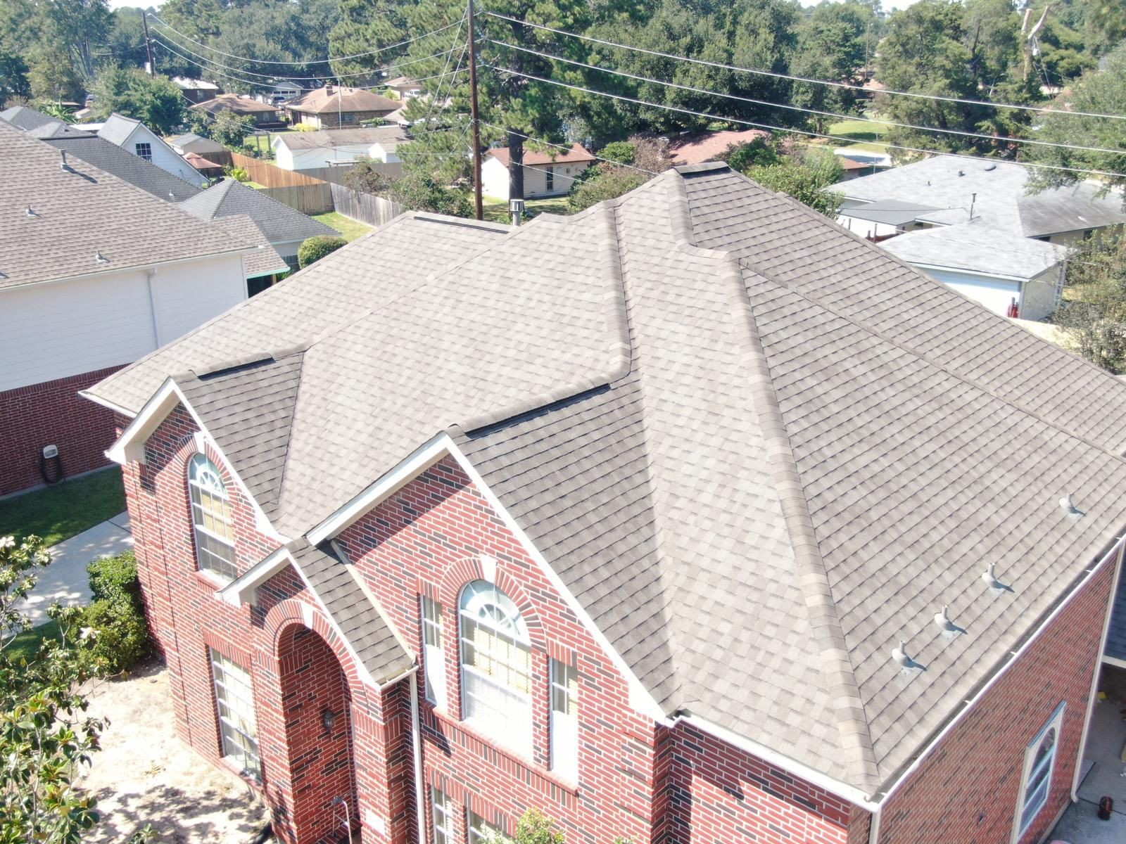 Aerial view of a completed residential shingle roof, photograph 13