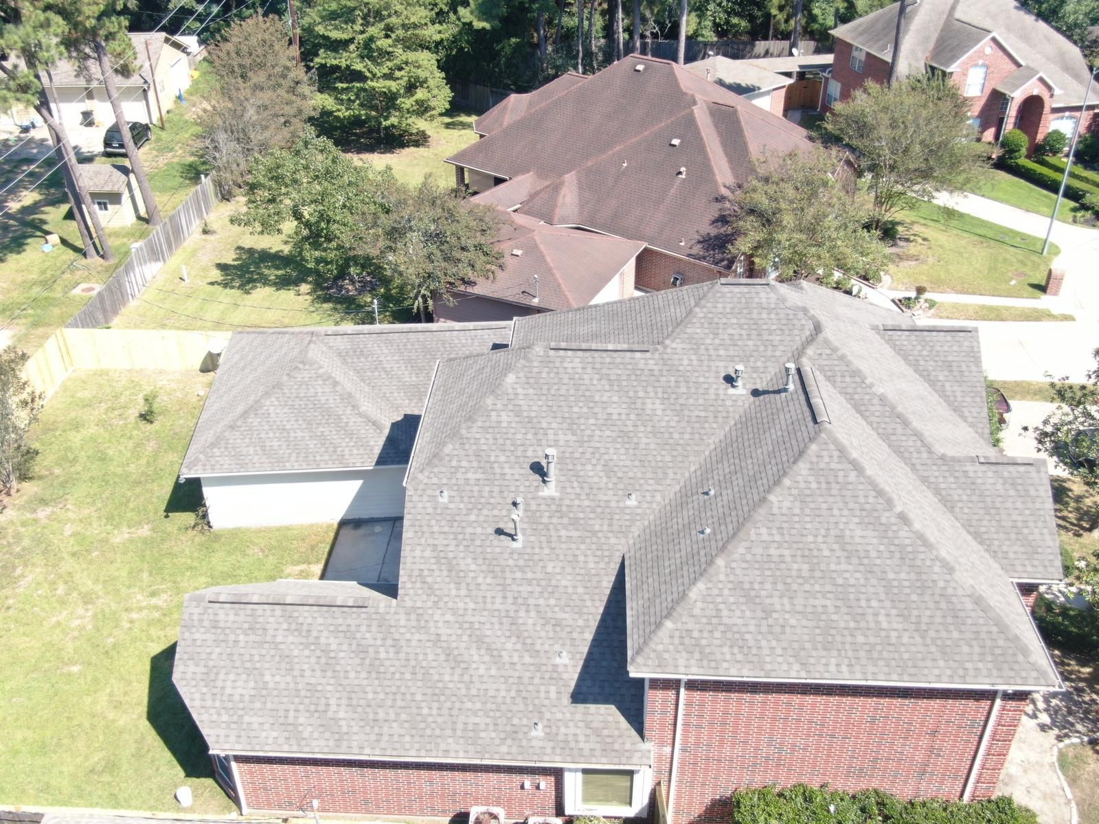 Aerial view of a completed residential shingle roof, photograph 14