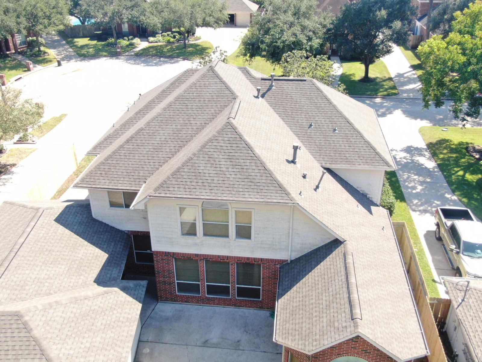 Aerial view of a completed residential shingle roof, photograph 15