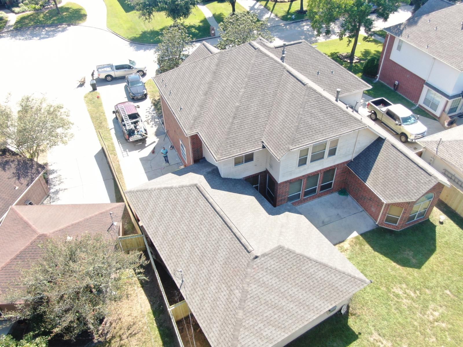 Aerial view of a completed residential shingle roof, photograph 16