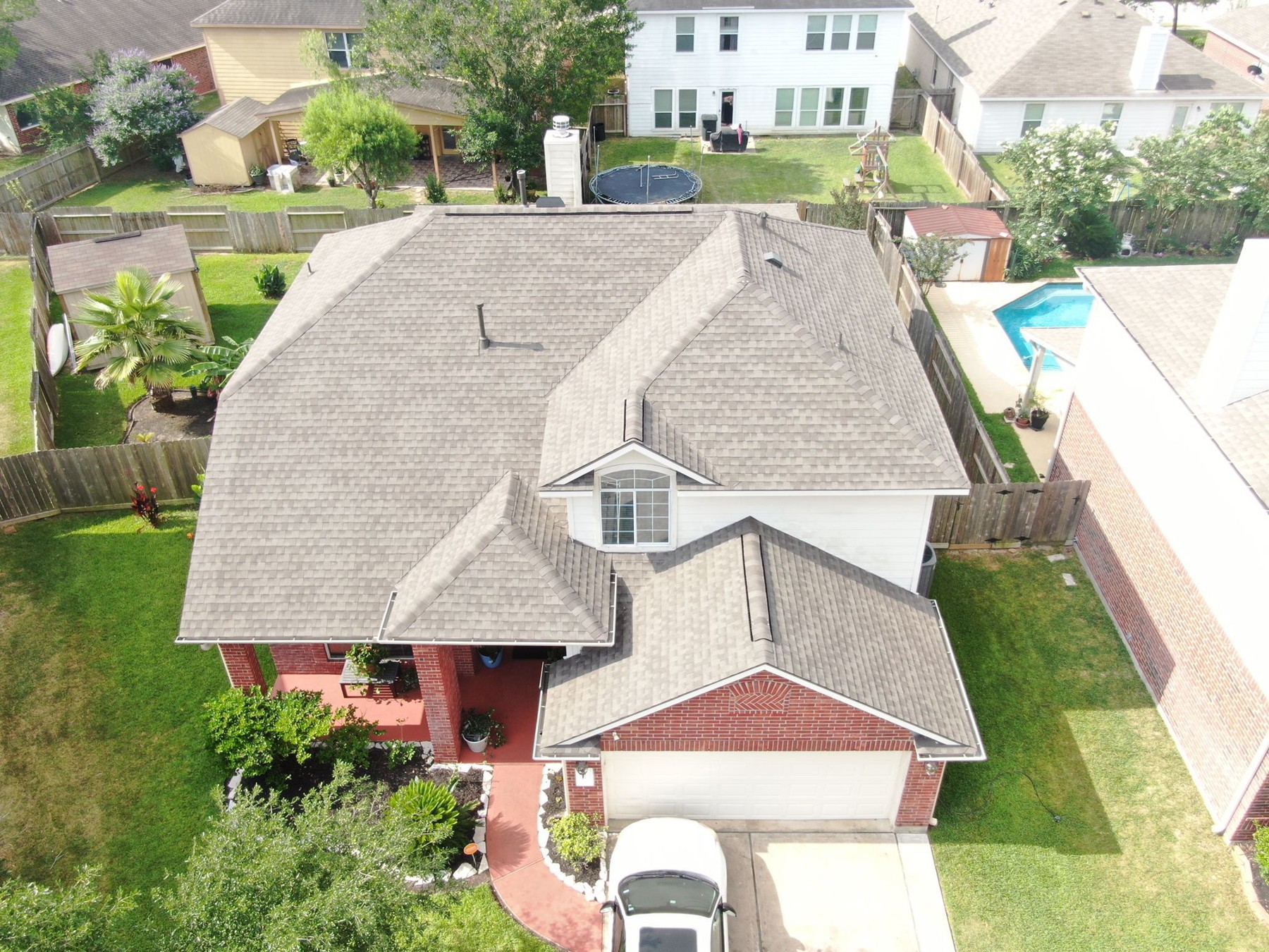 Aerial view of completed residential shingle roofing