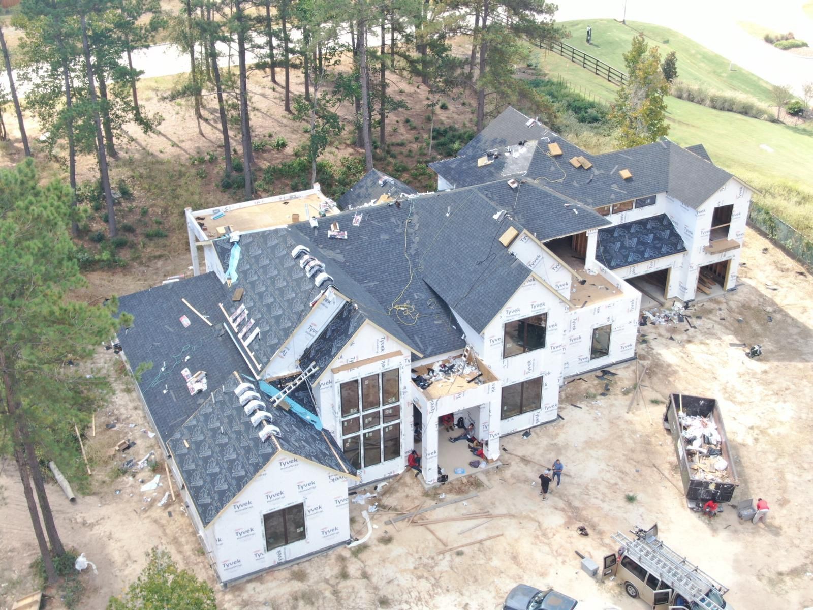 Aerial view of roof installation on new construction