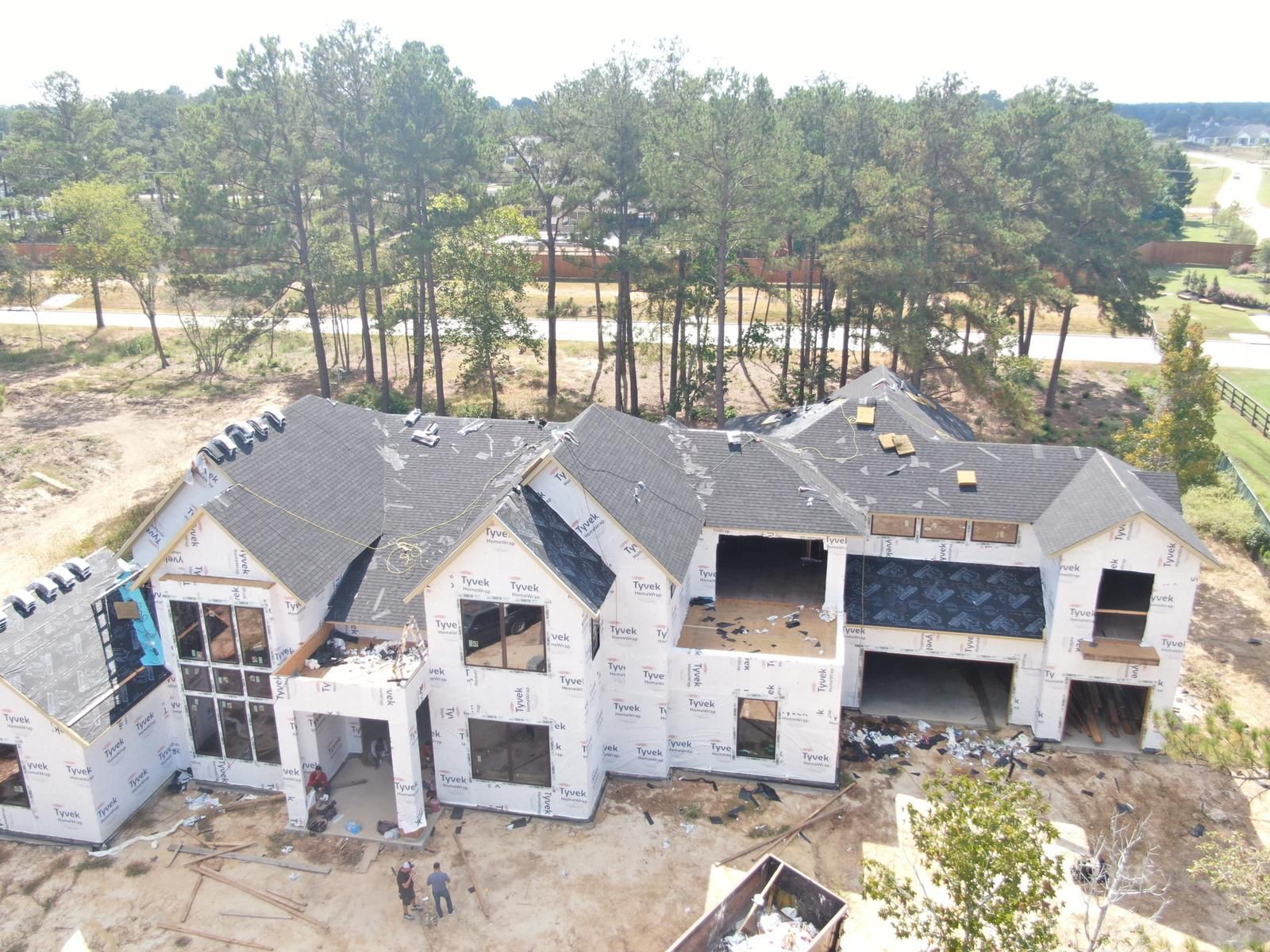 Front aerial view of a new construction roofing project