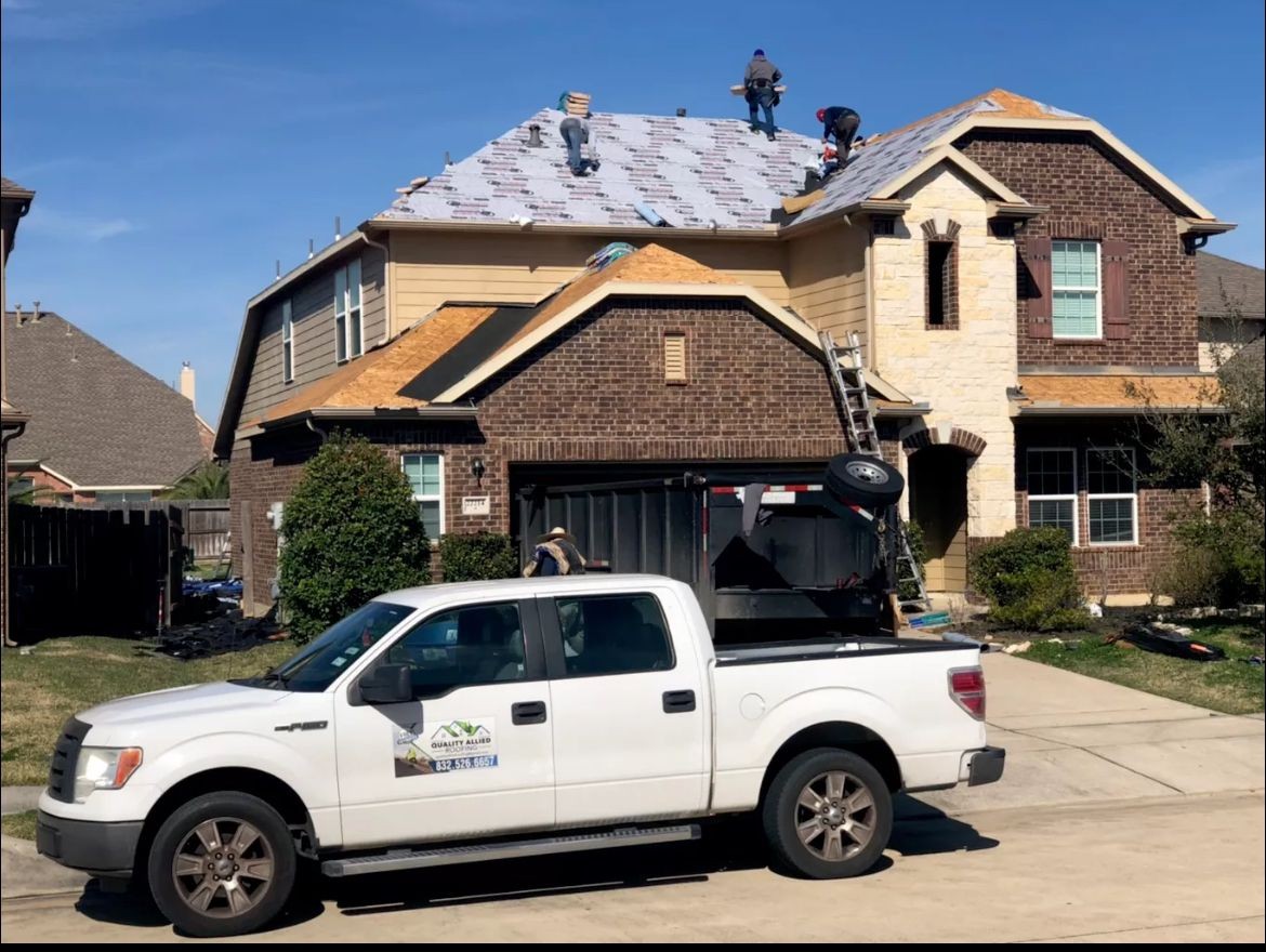 Roof installation in progress with underlayment visible